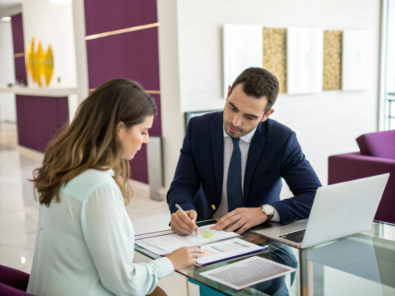 Financial documents and reports being reviewed during a consultation